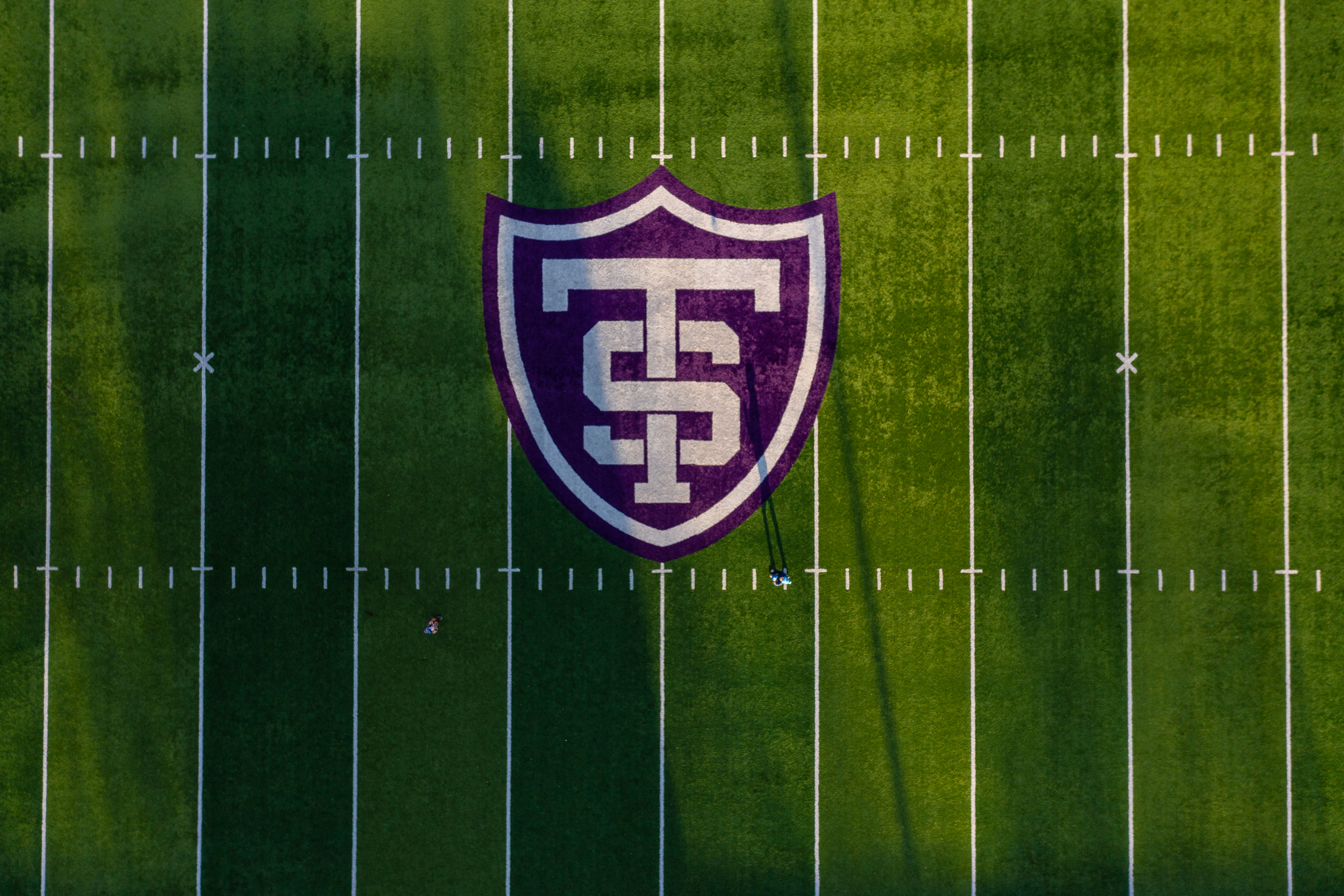 aerial photo of the st. thomas logo at the 50 yard line of O'Shaughnessy Stadium