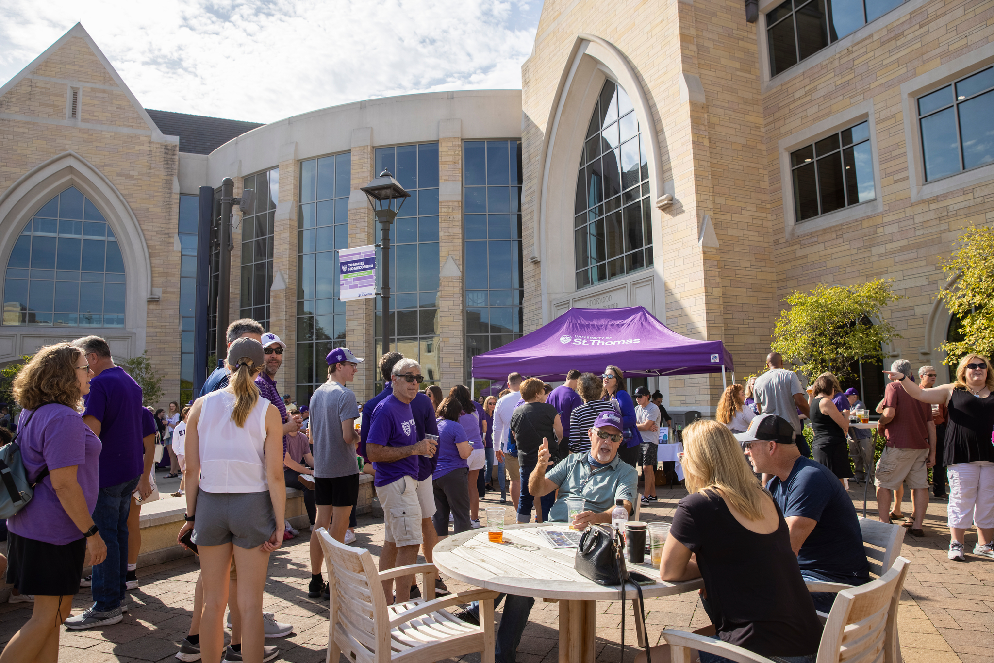 Tommie community spending time outside on the John P. Monahan Plaza during Family Weekend