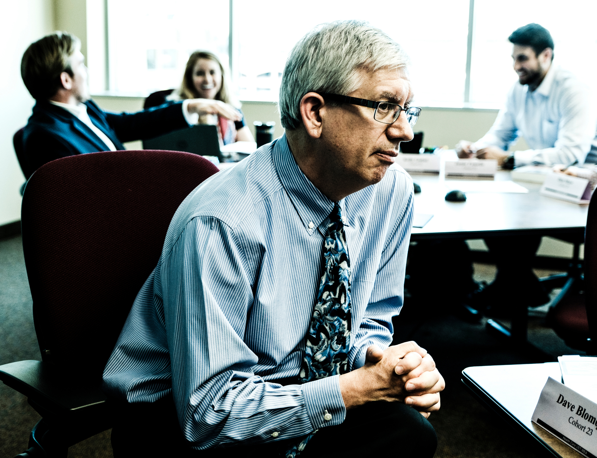  Professor Bob Connor listens in on a student discussion during a Health Care MBA class June 2, 2016. 