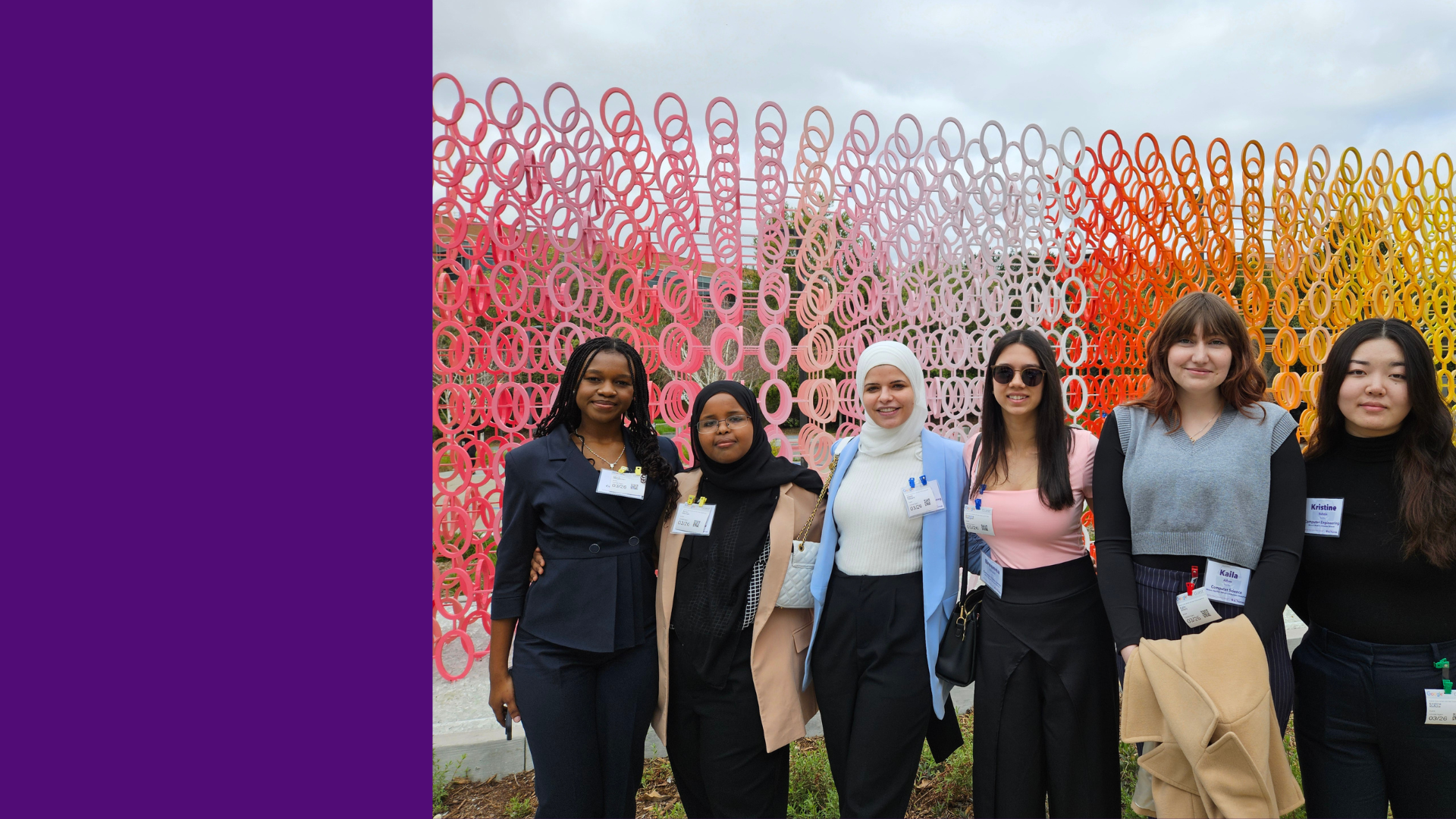 Students stand in front of colorful wall during Career Trek