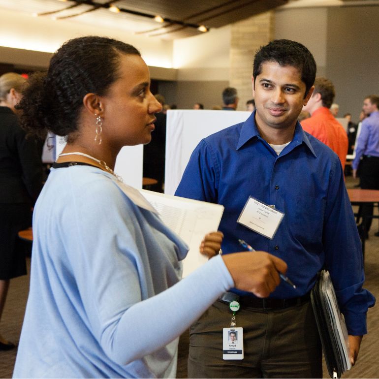 Employers and potential employees at a job fair