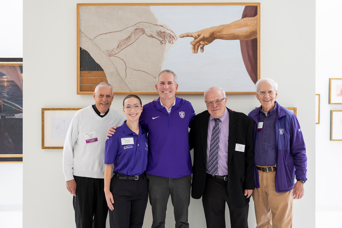 Purple Guard members and Rob Vischer smiling for a photo