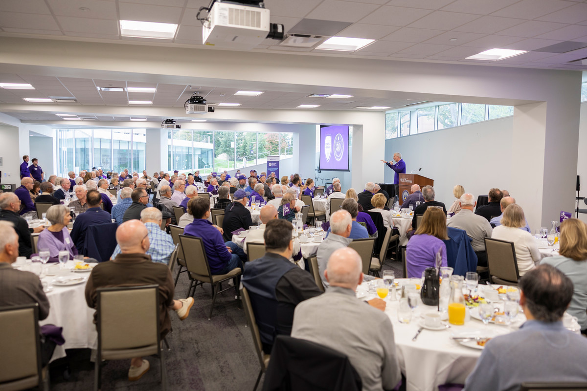An overview photo of all the Purple Guard attendees at their brunch tables