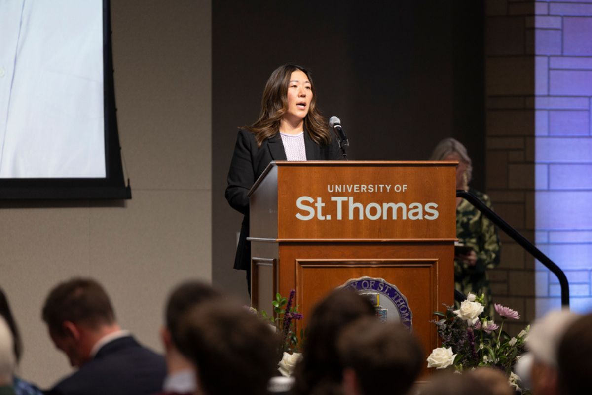 Dr. MayKao Hang speaks at a podium