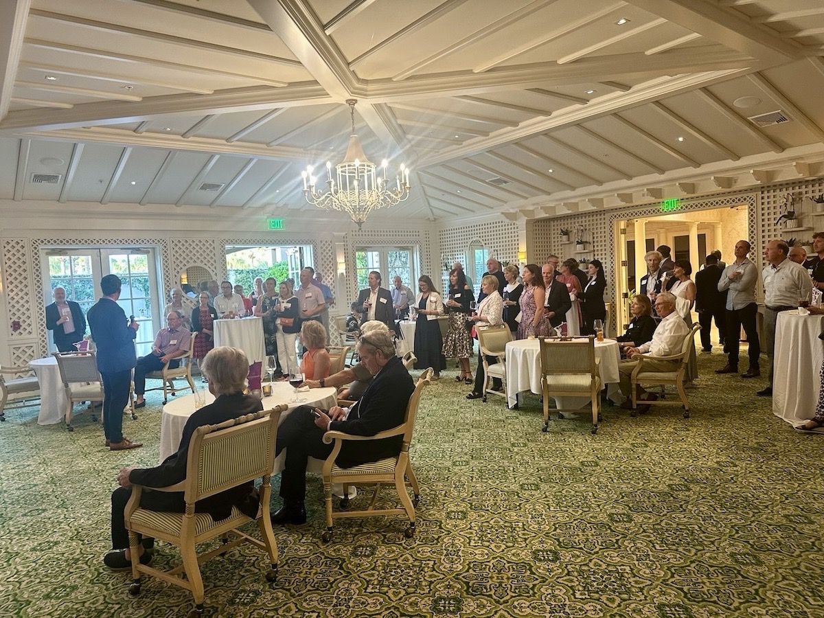 A wide view of the ballroom and all TOTR Naples attendees listening to President Vischer speak