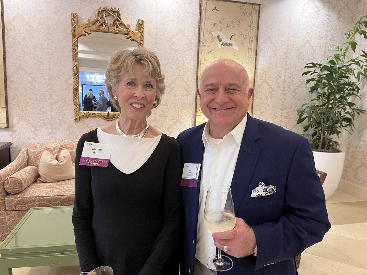 Joe Plante and Mollie Raih pose together for a photo in the Royal Poinciana ballroom