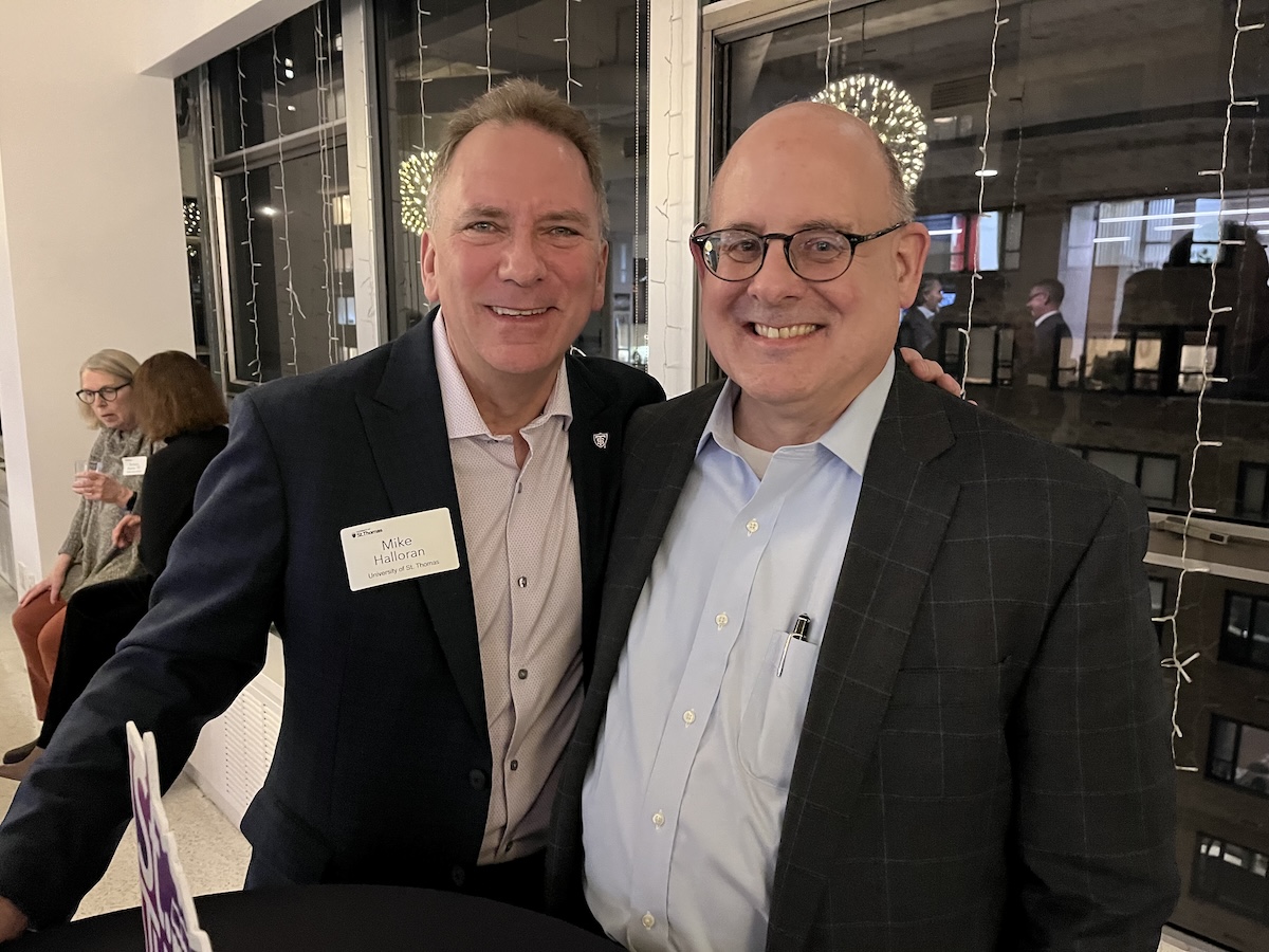 Mike Halloran poses for a photo with a fellow TOTR NYC attendee