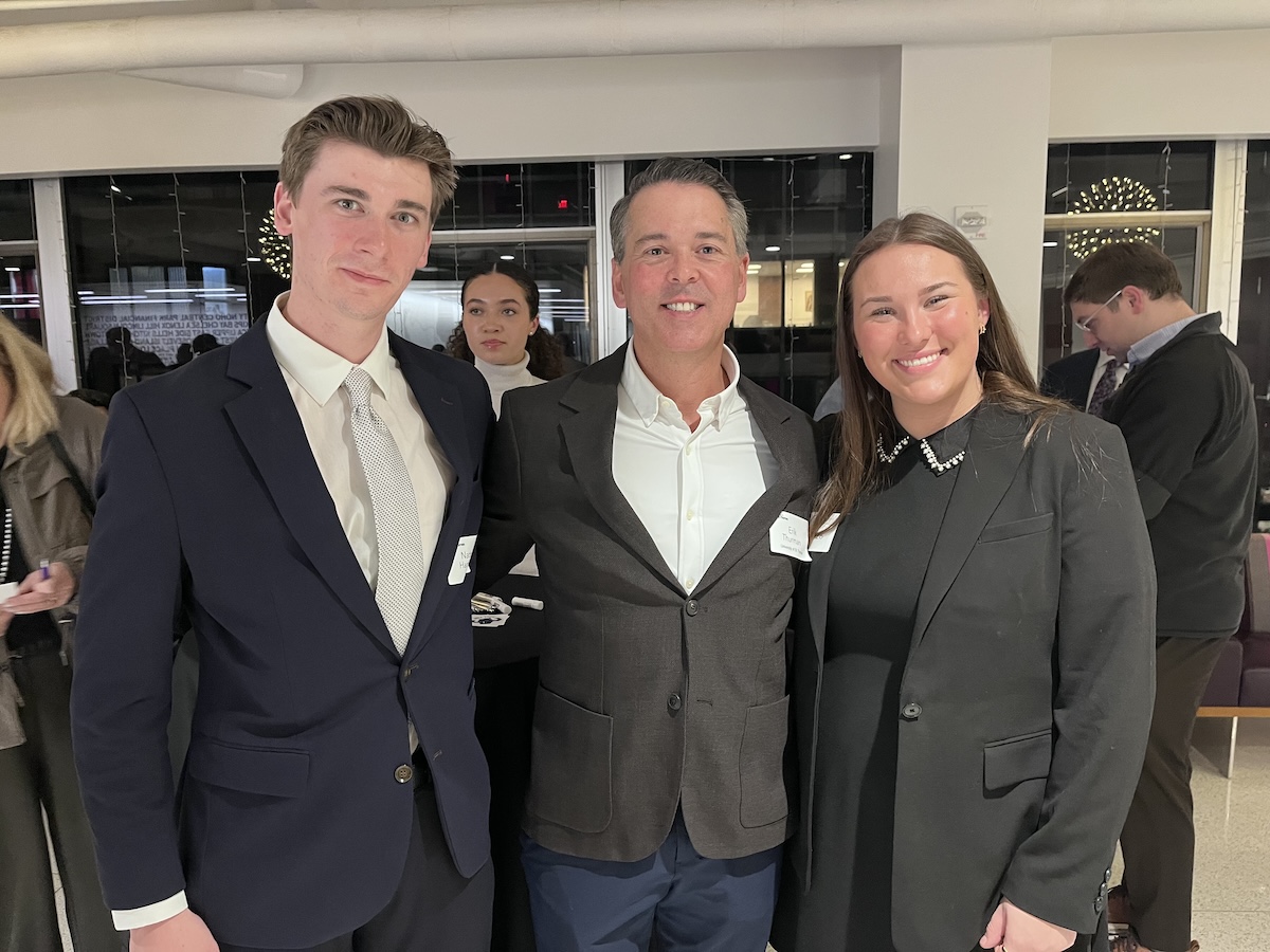 Erik Thurman poses with two TOTR NYC 2026 attendees