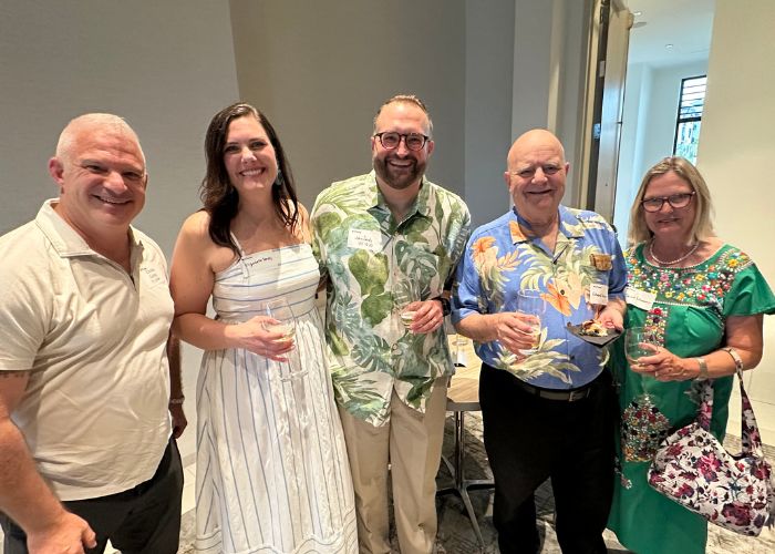 St. Thomas alumni pose for a photo at Tommies On the Road: Naples in February 2025. 