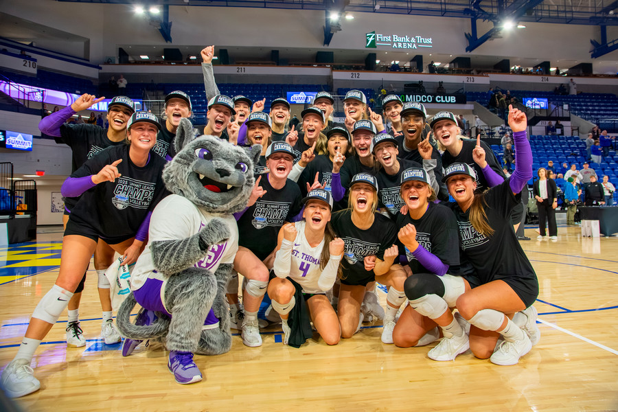 St. Thomas volleyball celebrating their championship win on the court