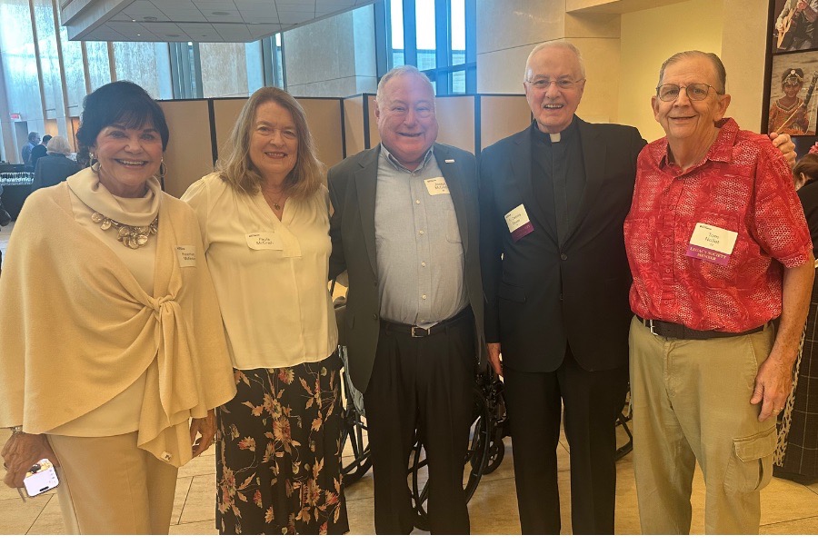 Father Dease smiles for a group photo with TOTR Phoenix attendees.