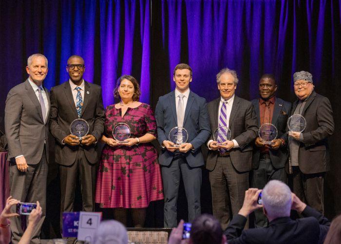 St. Thomas Day 2025 on April 23, 2025 in St. Paul. President Vischer poses with the six St. Thomas Day honorees.