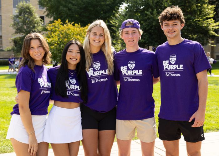 Students pose together during March into the Arches event.