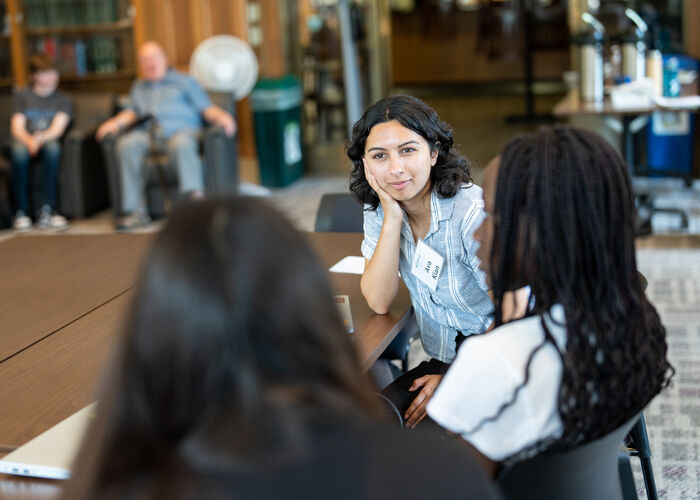 Students listening to mentor.