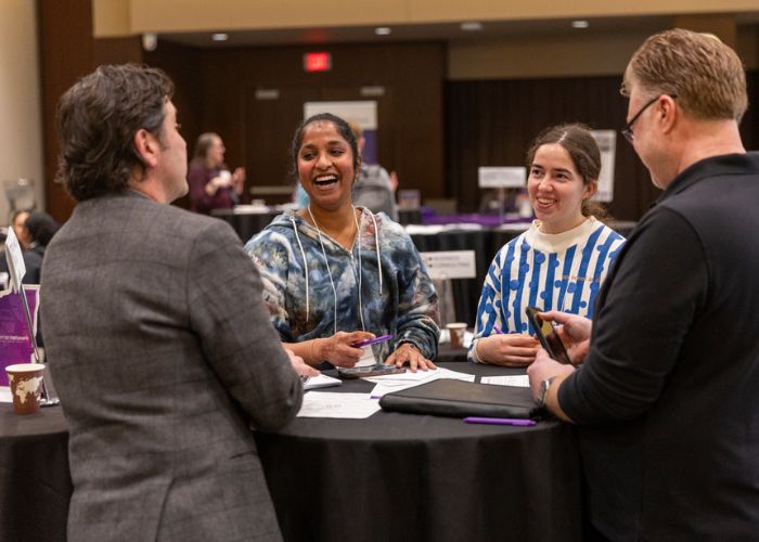 Students and alumni gather in Woulfe Hall for Tommies Together mentoring event.