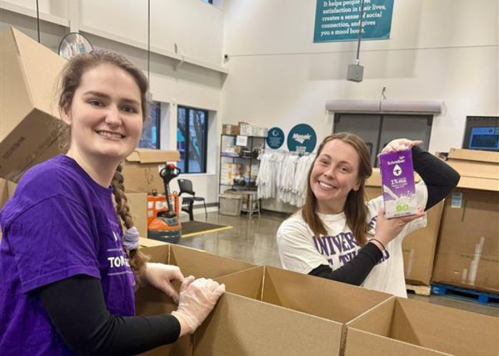 Volunteers work at food shelf. 