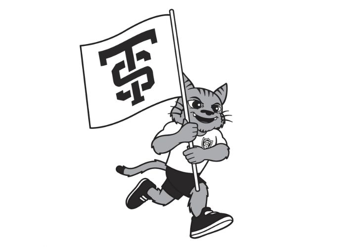 A cartoon of Tommie running with a St. Thomas flag