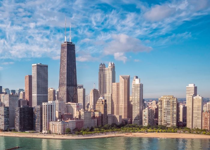 The Chicago skyline on a sunny day, viewed from Lake Michigan with the Sears Tower at the center