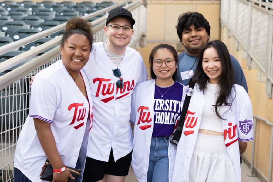 Students pose at Target Field during St. Thomas Night with the Twins. 