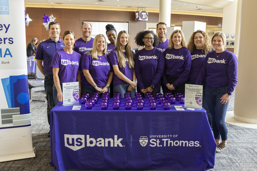 Volunteers at the US Bank table for an event in Anderson Student Center.