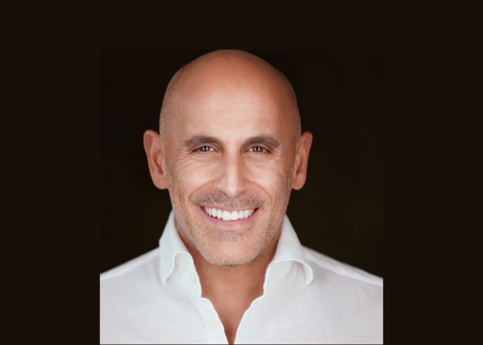Marc Lore wears a white shirt and smiles into the camera