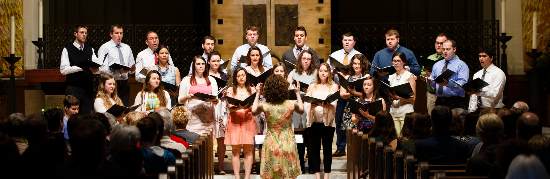 alumni choir performing in the Chapel of St. Thomas Aquinas