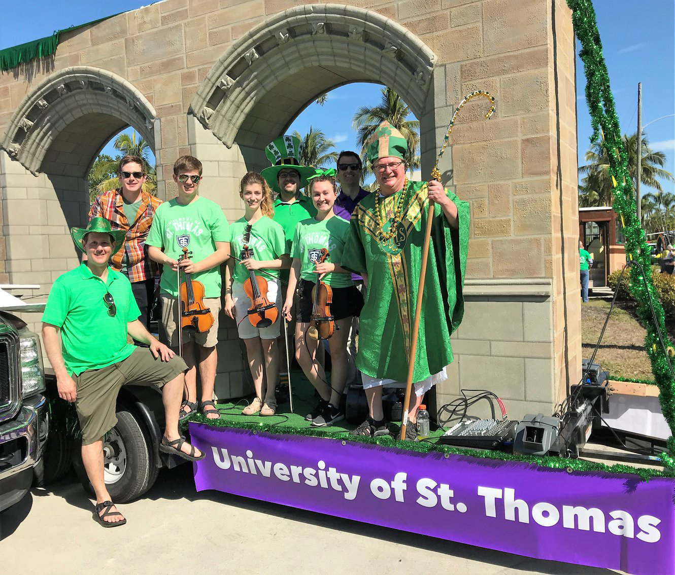 st. thomas students wearing green in a st. patricks day parade in Naples, Florida