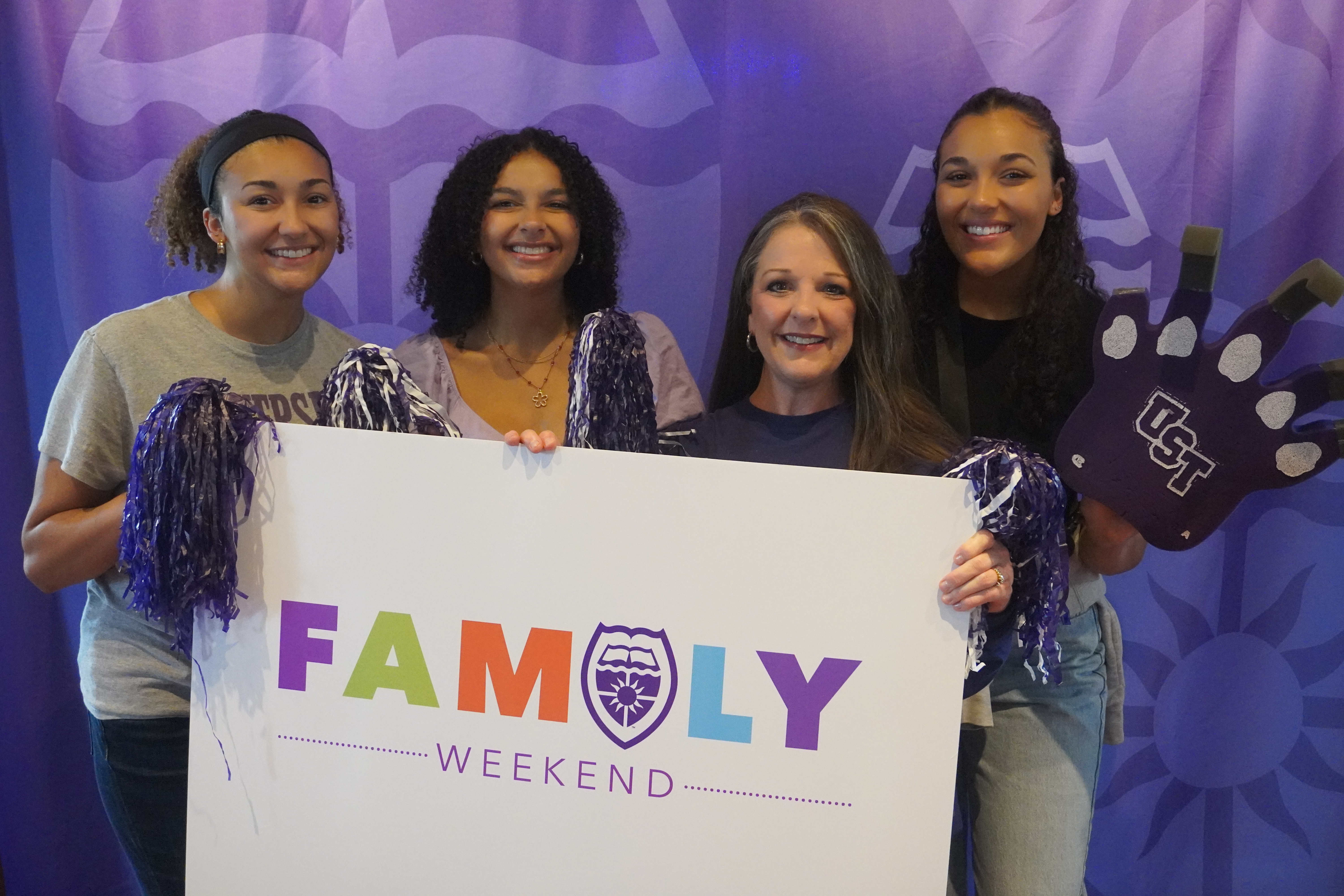 Family posing for a picture at Family Weekend 2023